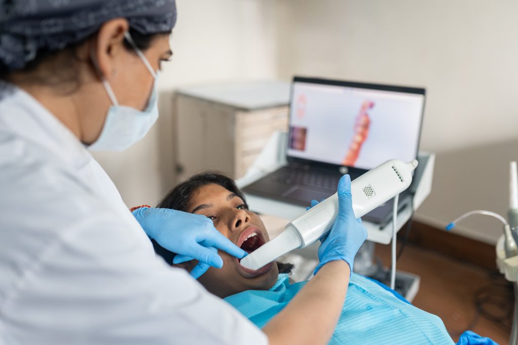 Dentist using an intraoral scanner